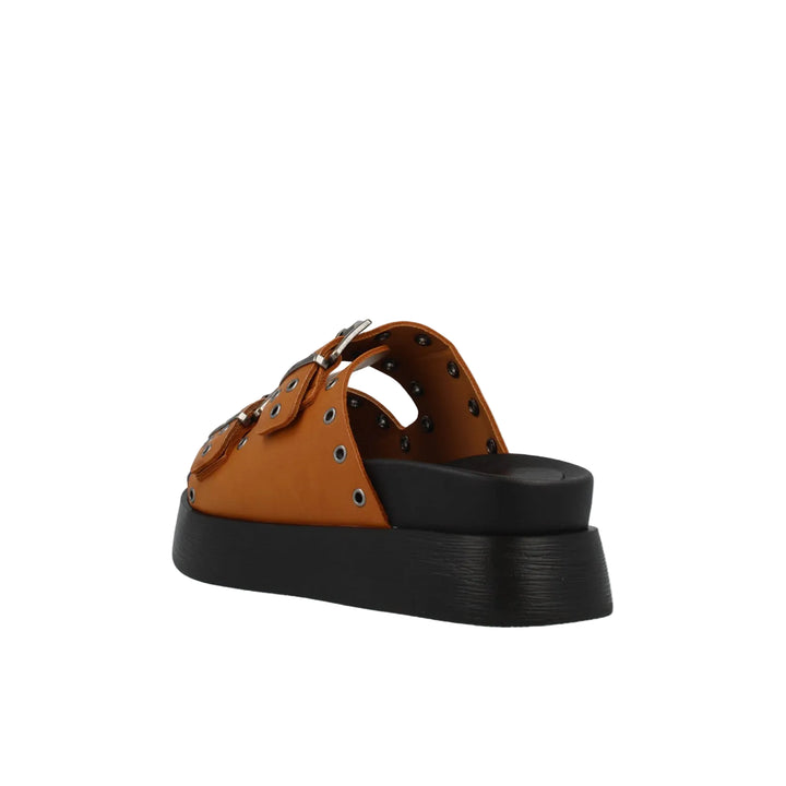 Brown sandal with black sole on a light gray background