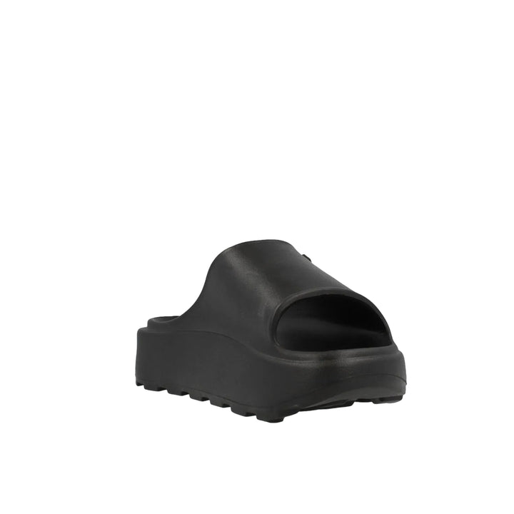 Black slide sandal on a light gray background