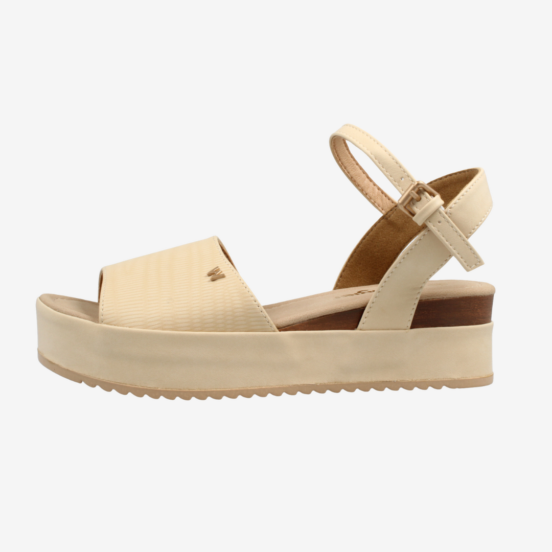 Beige sandal with a platform sole on a white background