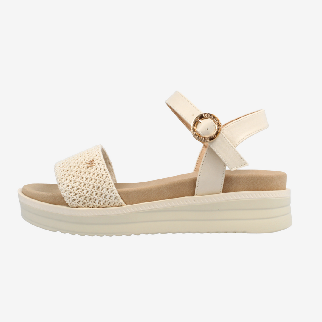 Beige sandal with a textured strap on a white background