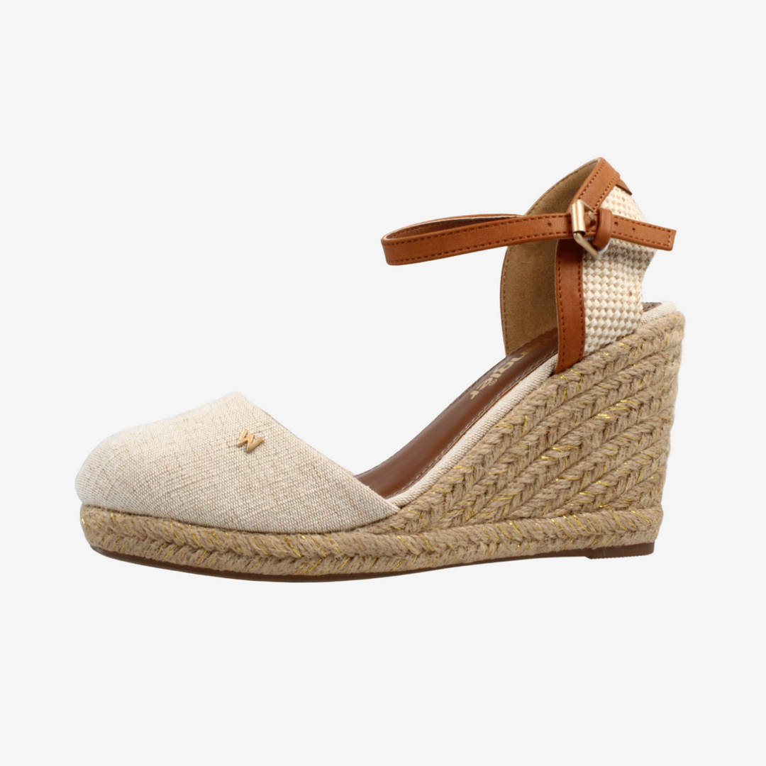 Beige wedge sandal with brown strap on a white background