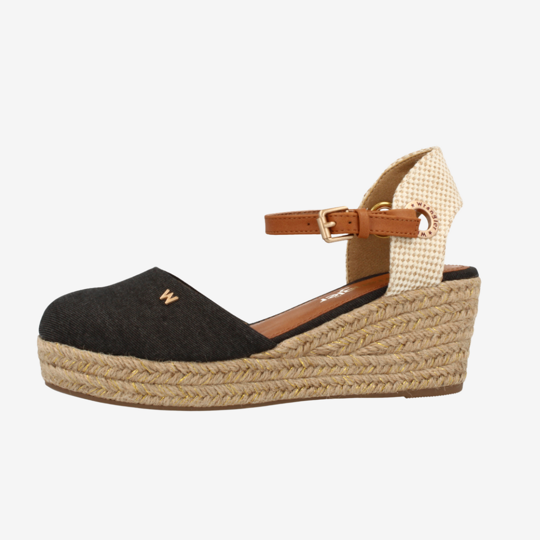 Black wedge sandal with woven sole on a white background