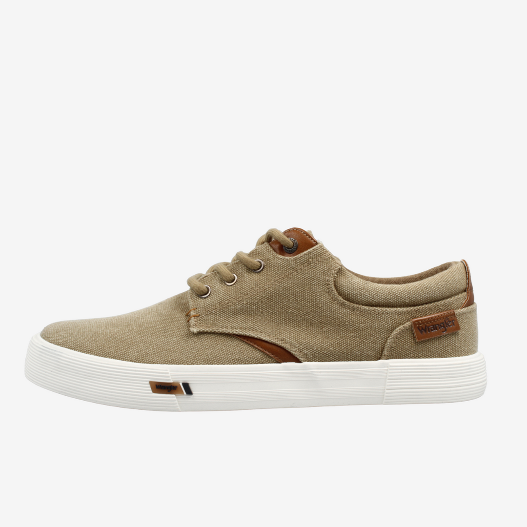 Beige sneaker with brown accents on a white background