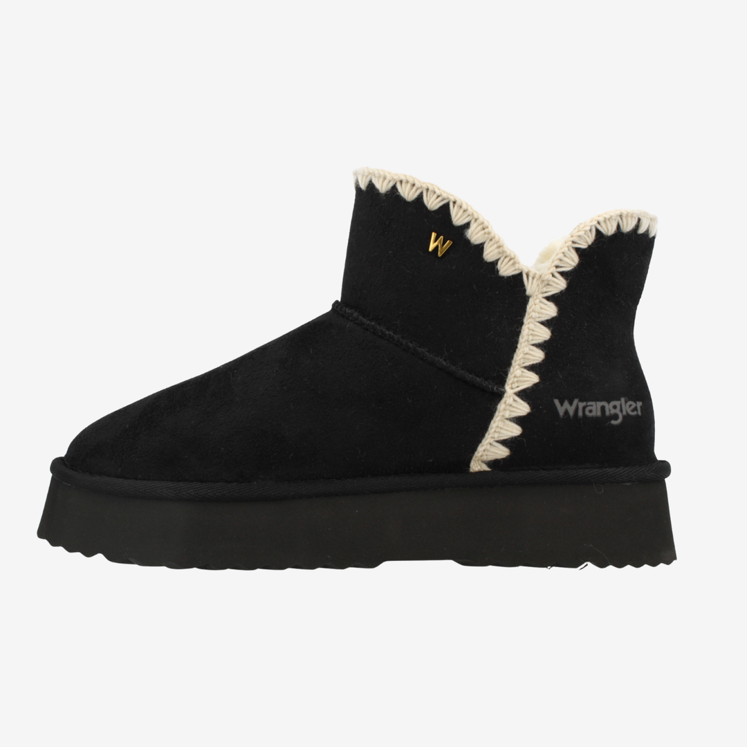 Black slip-on boots with cream trim and 'Wrangler' branding on a white background