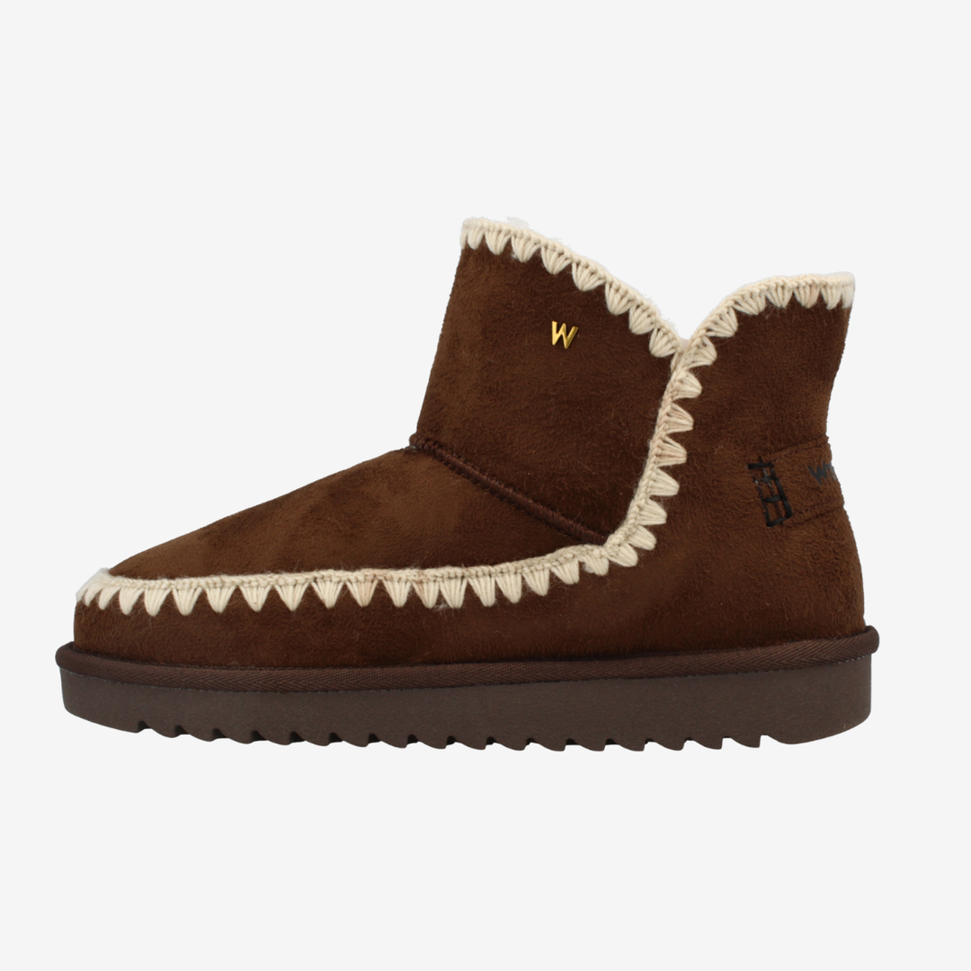 Brown boot with white trim on a white background