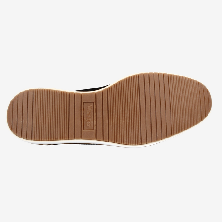 Close-up of a shoe sole with a brand logo on a white background