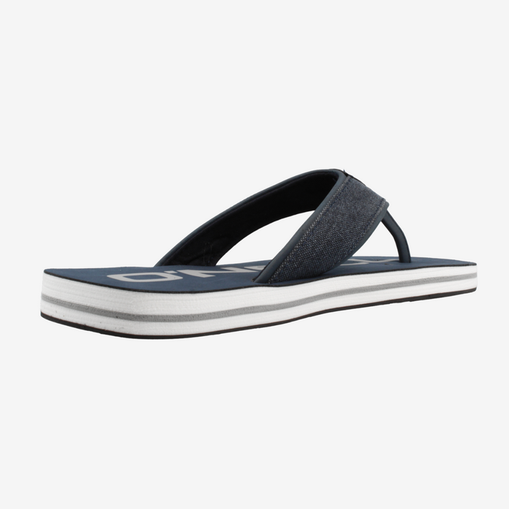 Blue sandal with white sole on a light gray background