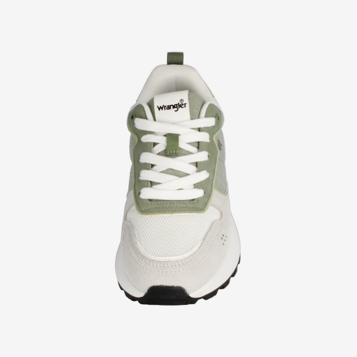 White and green sneaker with 'Wrangler' branding on a white background