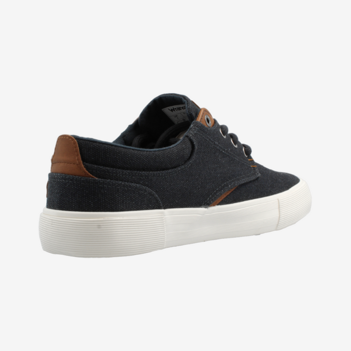 Black sneaker with white sole on a light gray background