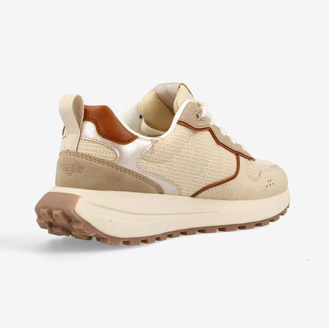 Beige sneaker with brown sole on a white background