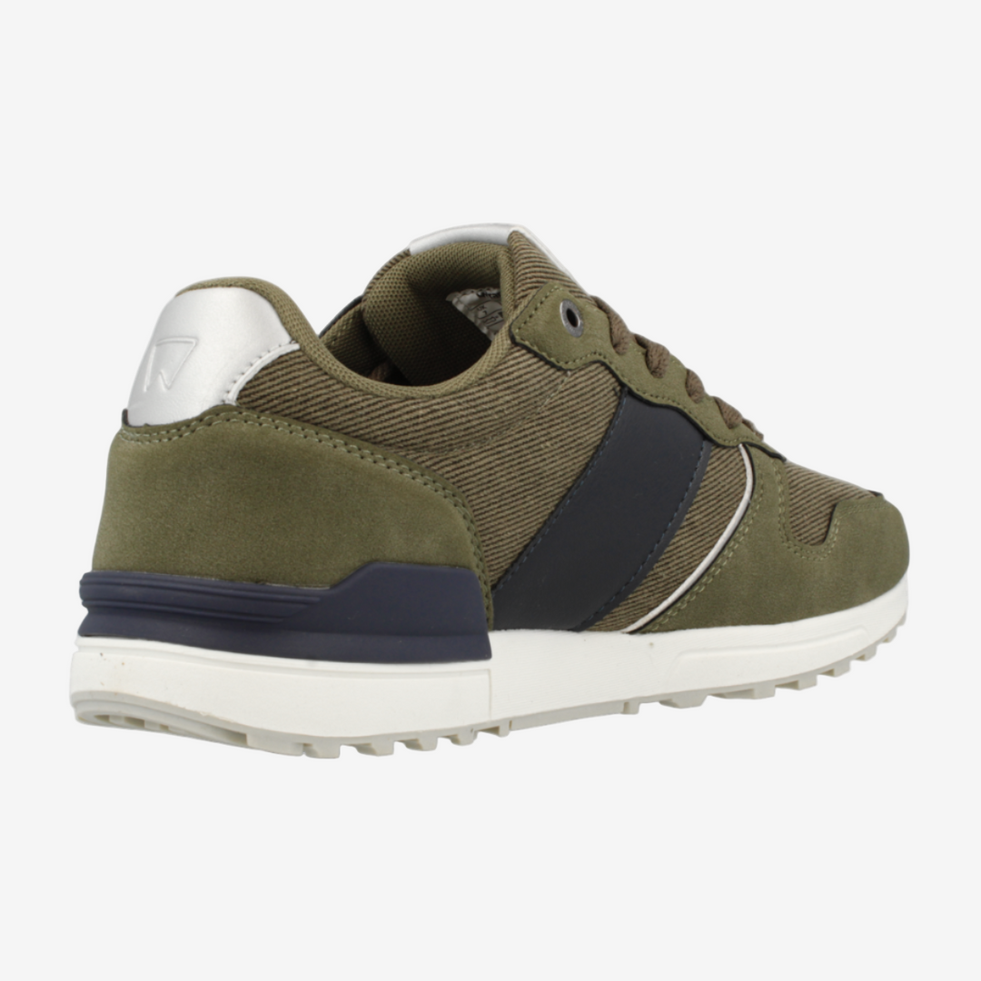 Green sneaker with navy accents on a white background
