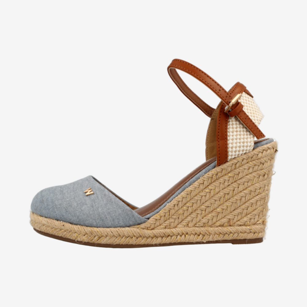 Wedge sandal with jute sole and brown strap on a white background