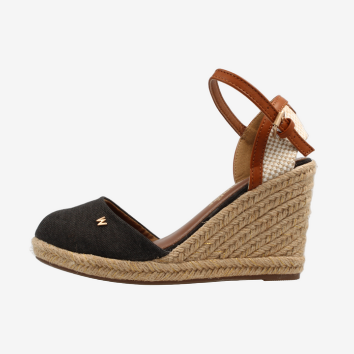 Wedge sandal with brown strap and jute sole on a white background