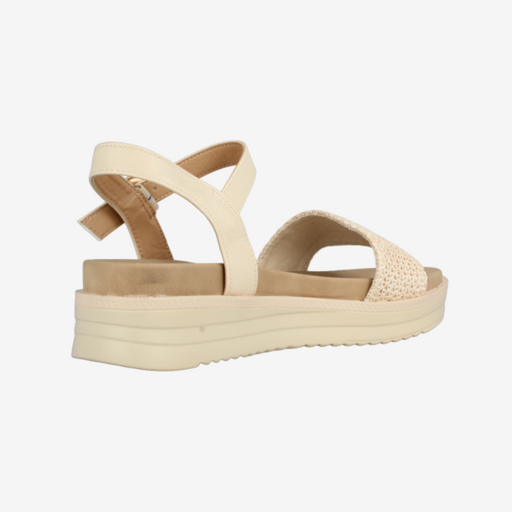 Beige sandal with a platform sole on a white background