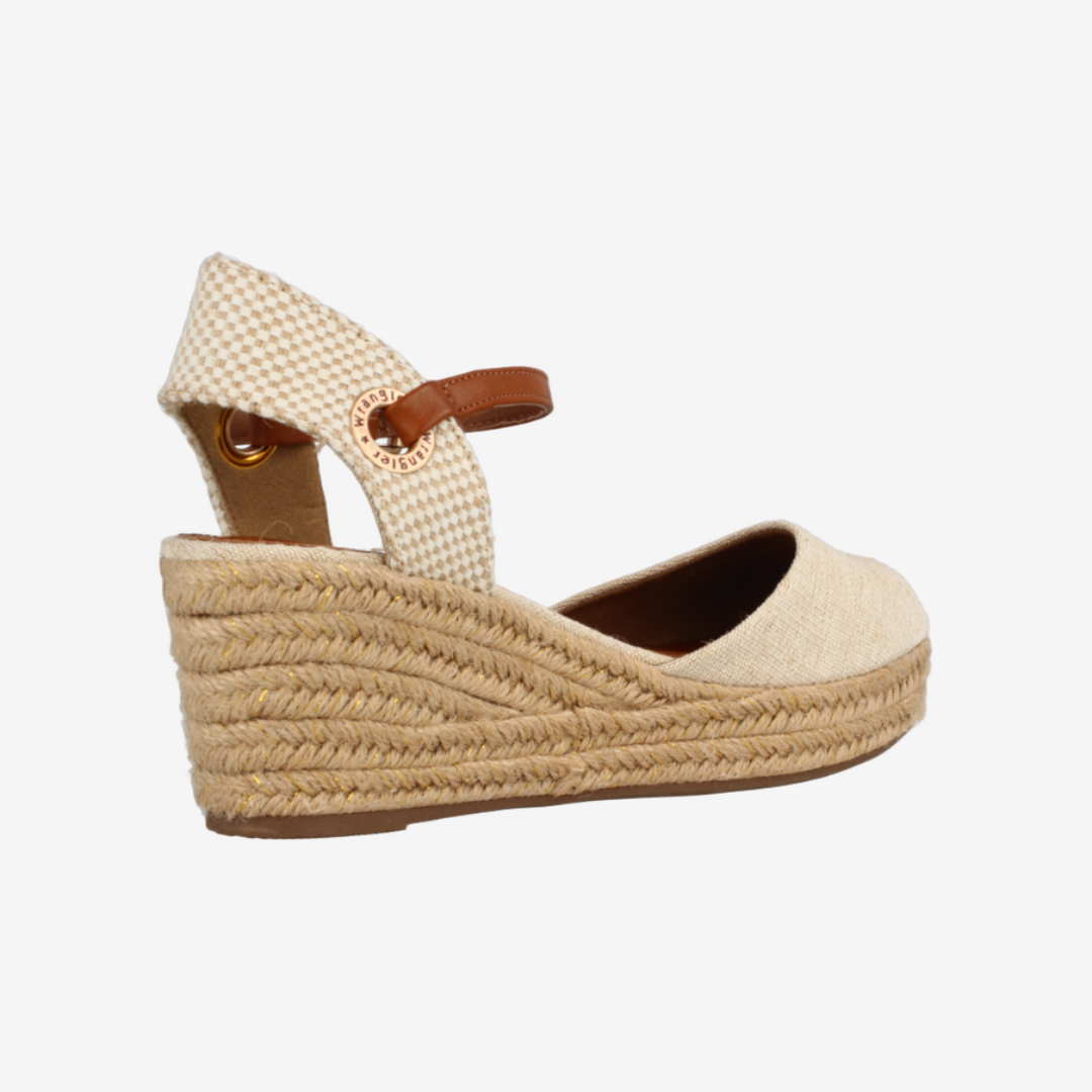 Beige wedge sandal with espadrille sole on a white background