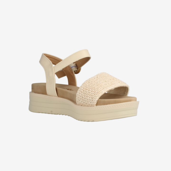 Beige sandal with platform sole on a white background