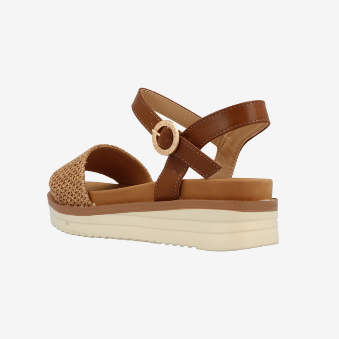 Brown platform sandal on a white background