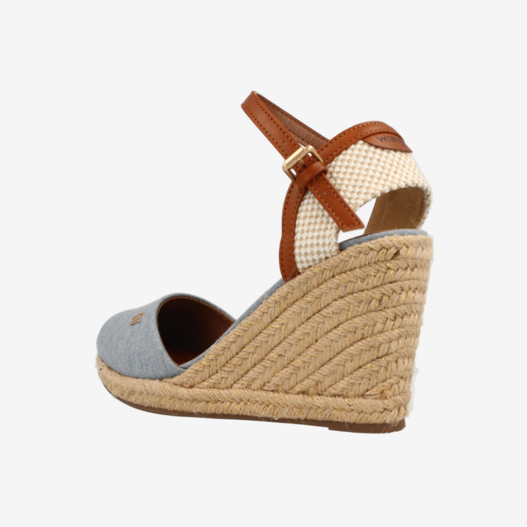 Wedge sandal with jute sole and brown strap on a white background