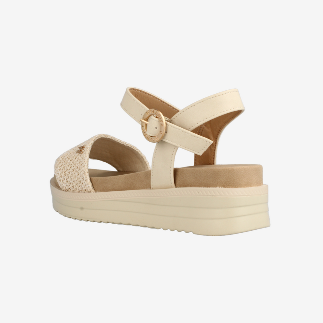 Beige sandal with platform sole on a white background