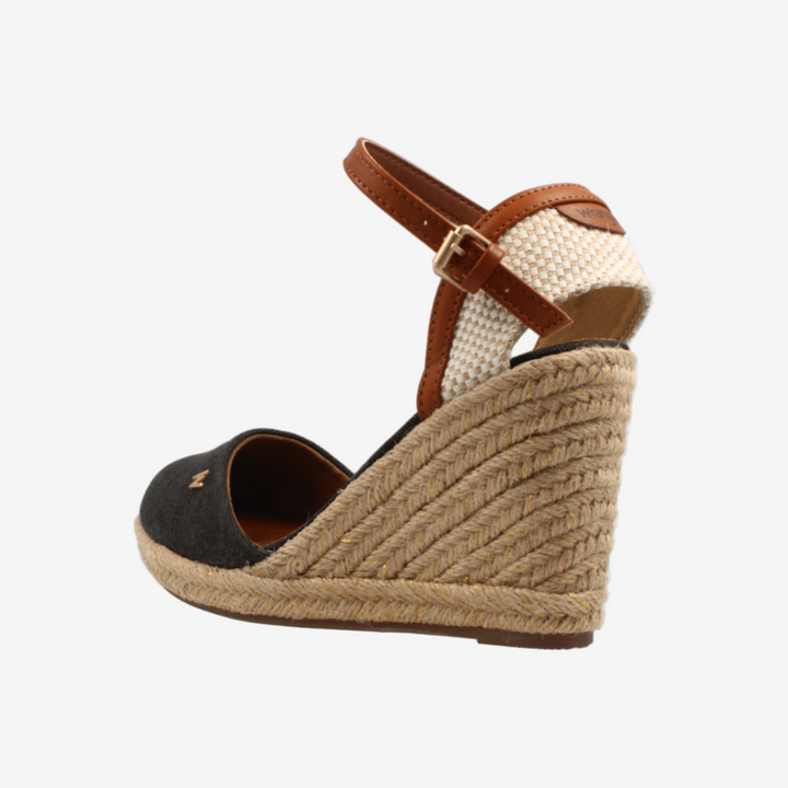 Wedge sandal with jute sole and brown strap on a white background