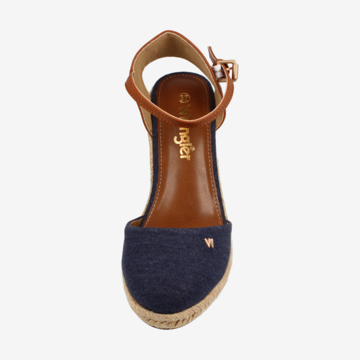 Navy blue espadrille sandal with brown ankle strap on a white background