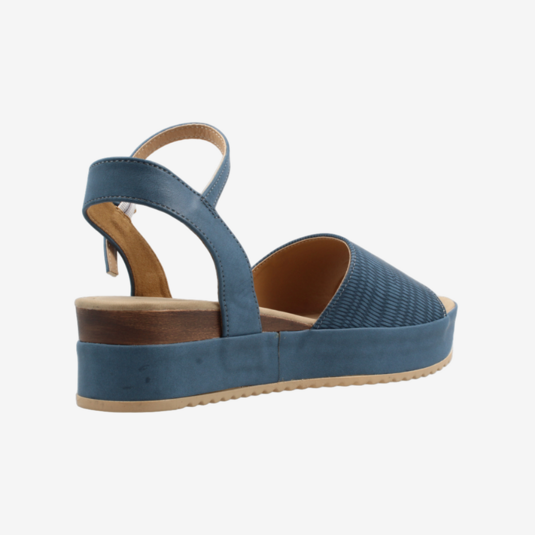 Blue wedge sandal on a white background
