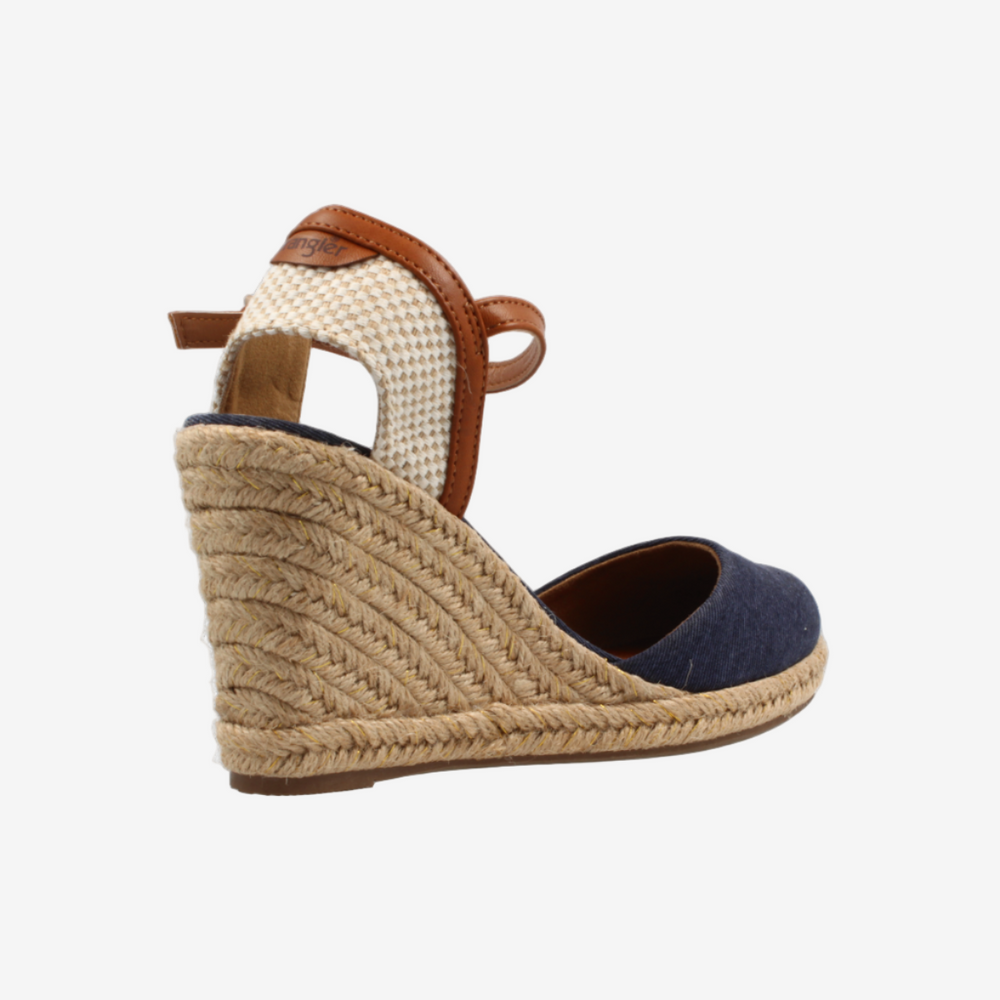 Wedge sandal with woven wedge and brown strap on a white background