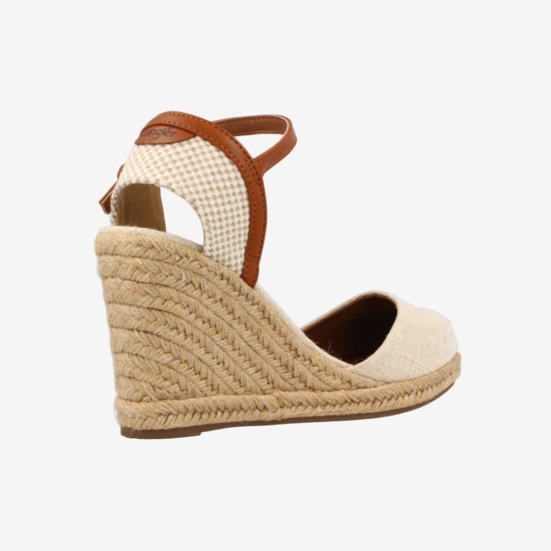 Beige wedge sandal with woven sole on a white background