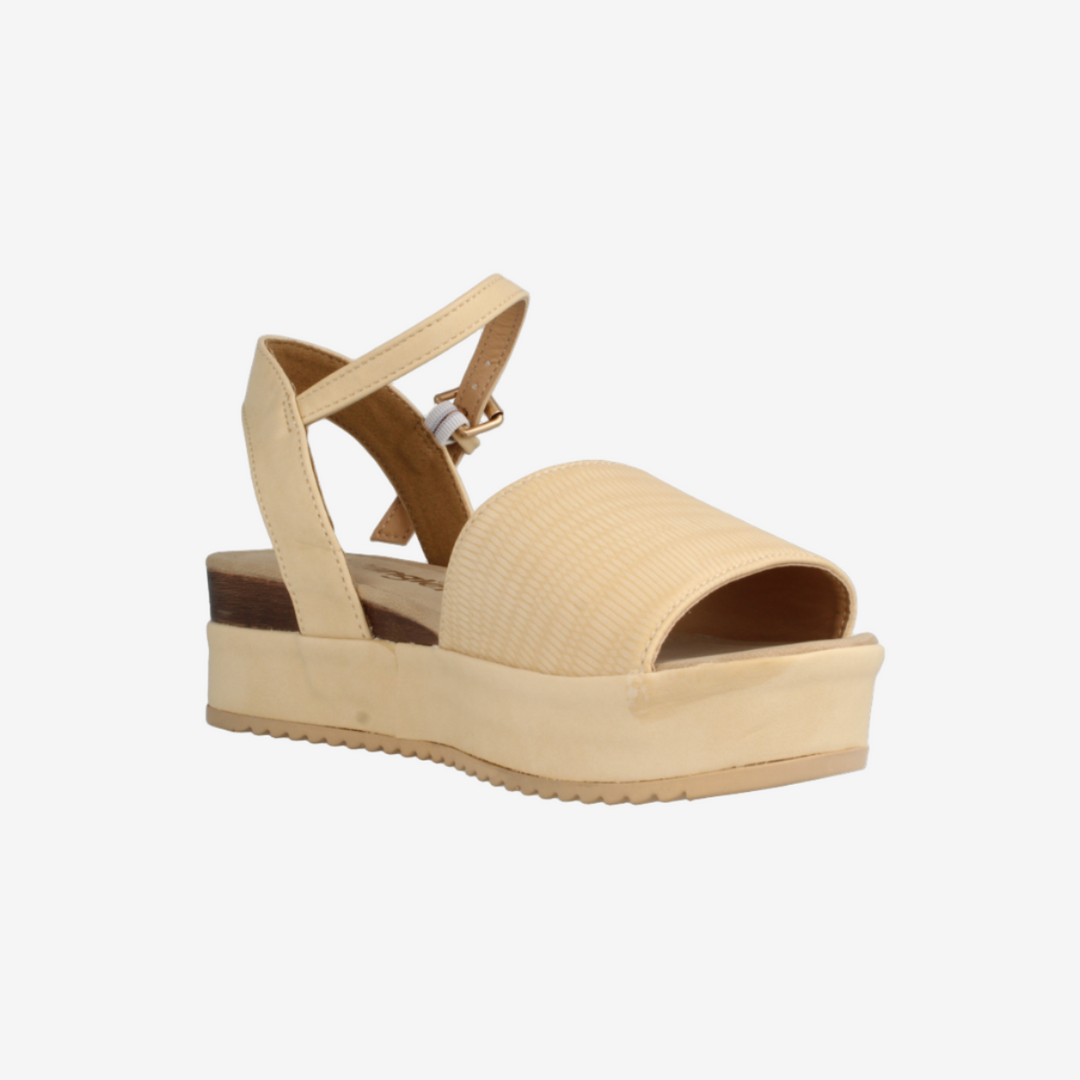 Beige sandal with a platform sole on a white background