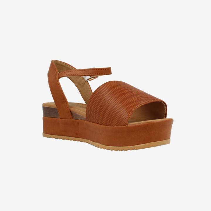 Brown sandal with platform sole on a white background