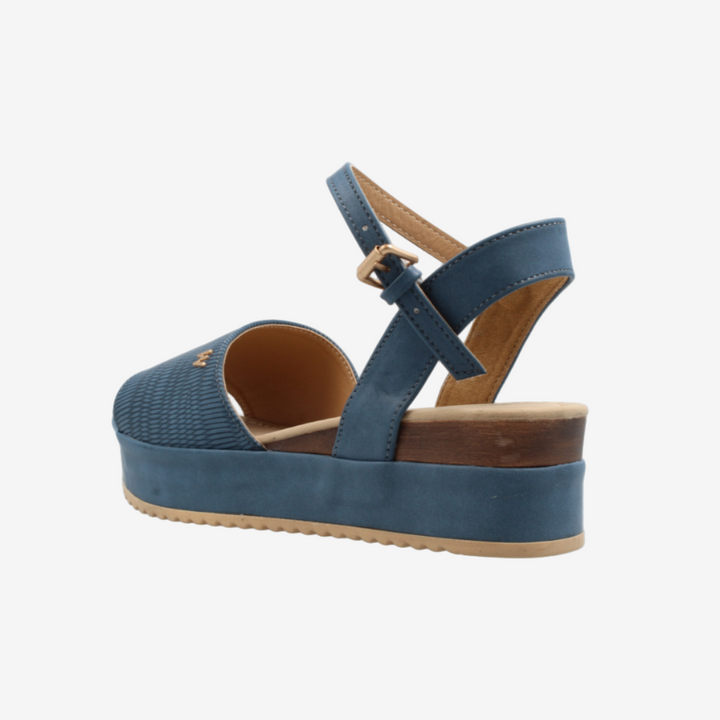 Blue sandal with a platform sole on a white background