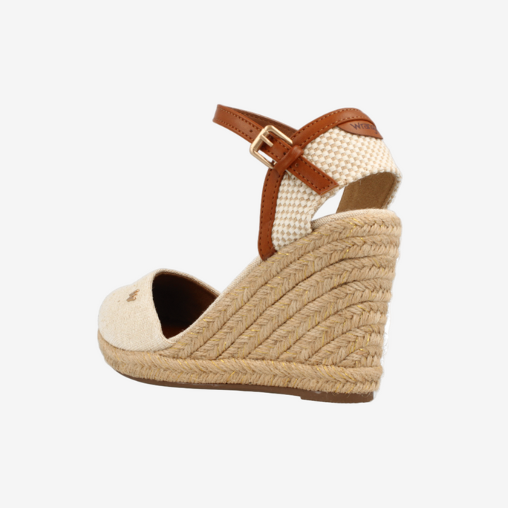 Beige wedge sandal with brown strap on a white background
