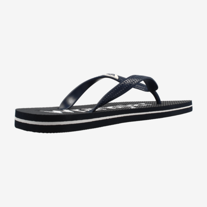 Black sandal with white sole on a light gray background