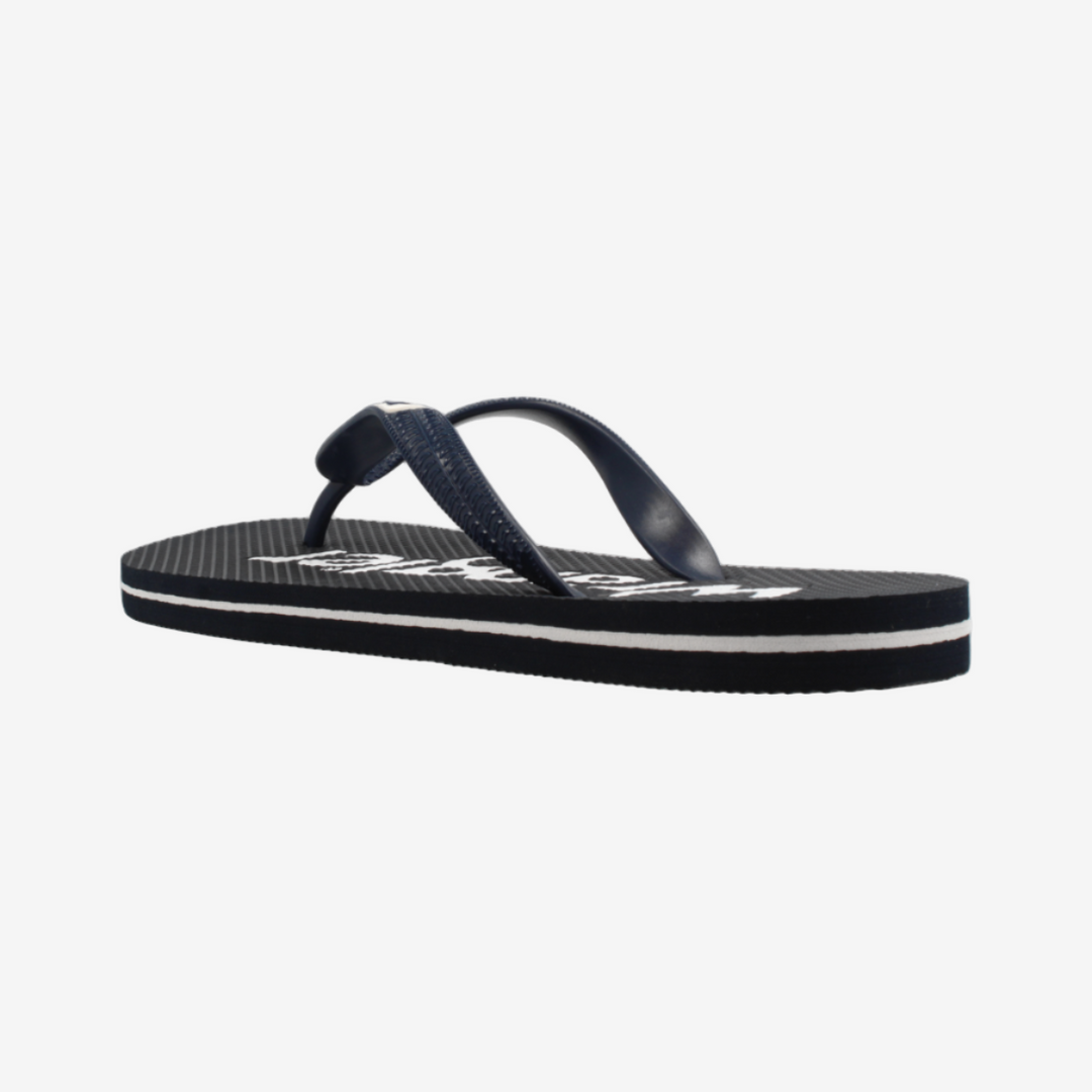 Navy blue sandal with white sole on a light gray background