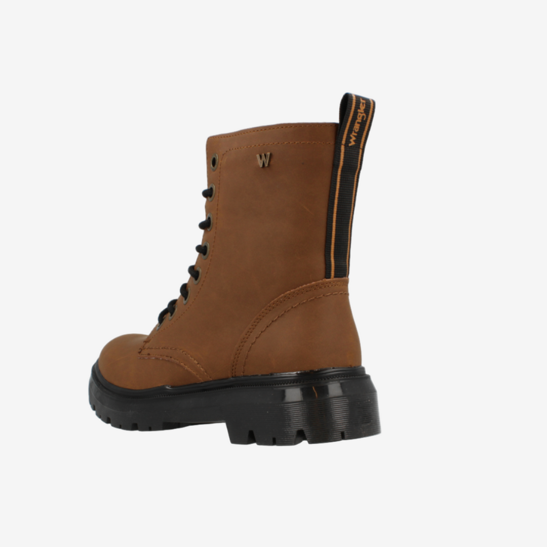 Brown boot with black sole on a white background