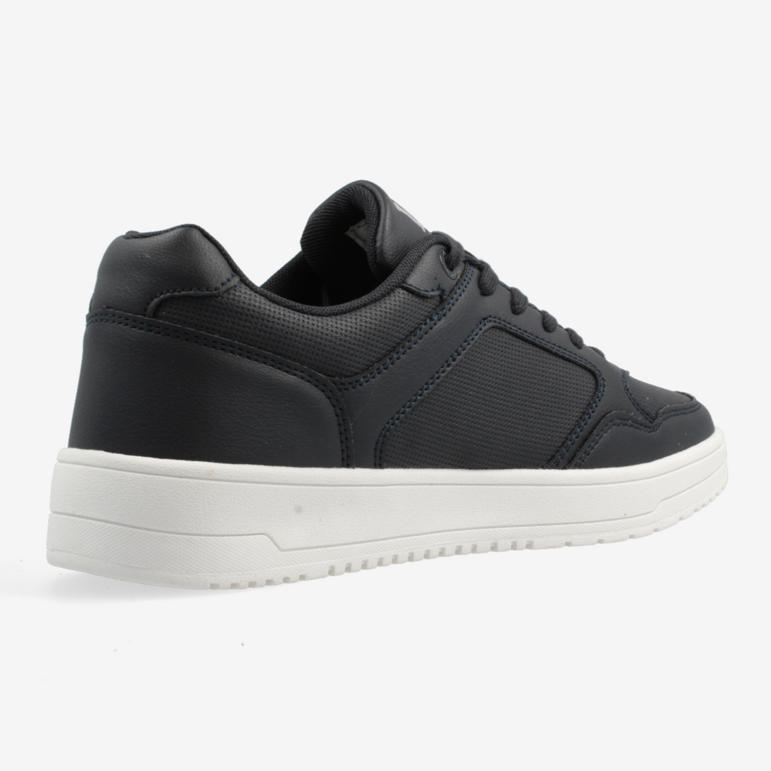 Black sneaker with a white sole on a light gray background