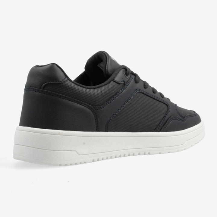 Black sneaker with a white sole on a light gray background