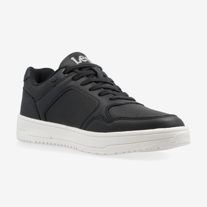 Black sneaker with white sole on a light gray background