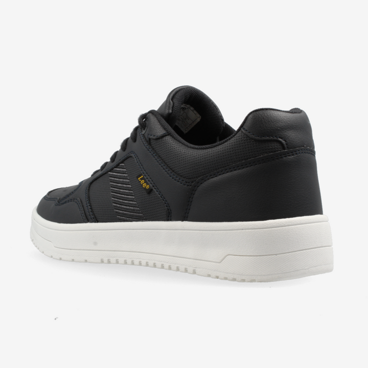 Black sneaker with white sole on a light gray background