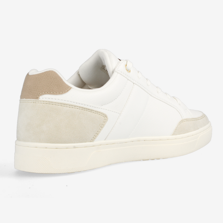 White sneaker with beige accents on a white background