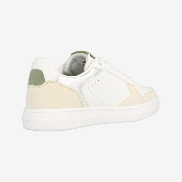 White sneaker with a green accent on a white background