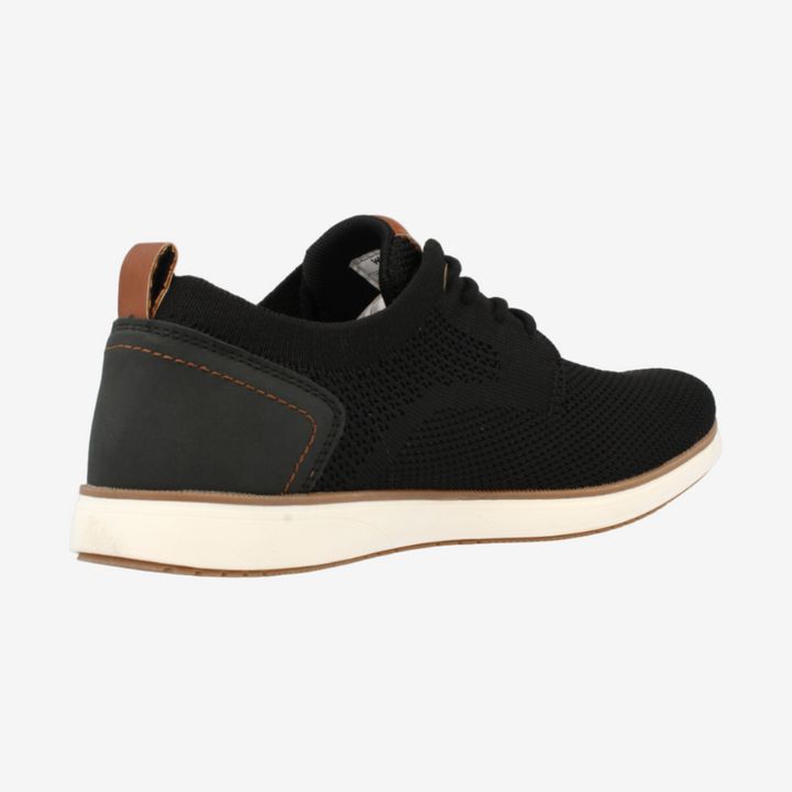Black sneaker with brown accents on a white background