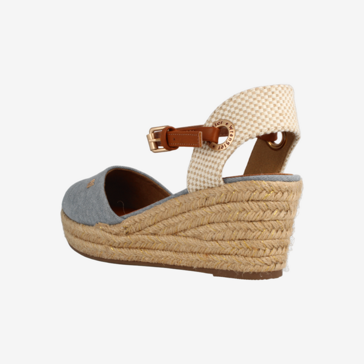 Woven wedge sandal with a gray sole on a white background