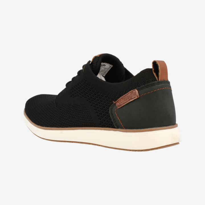 Black sneaker with brown accents on a white background