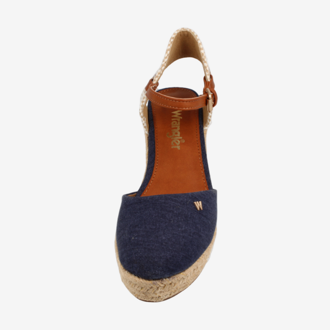 Navy espadrille sandal with brown sole on a white background