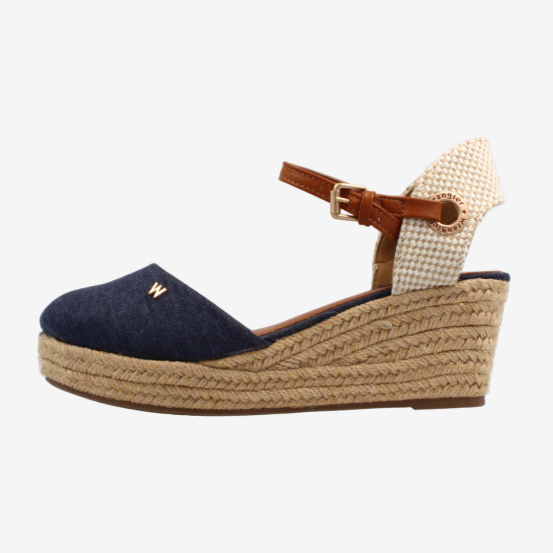 Navy wedge sandal with a brown strap on a white background