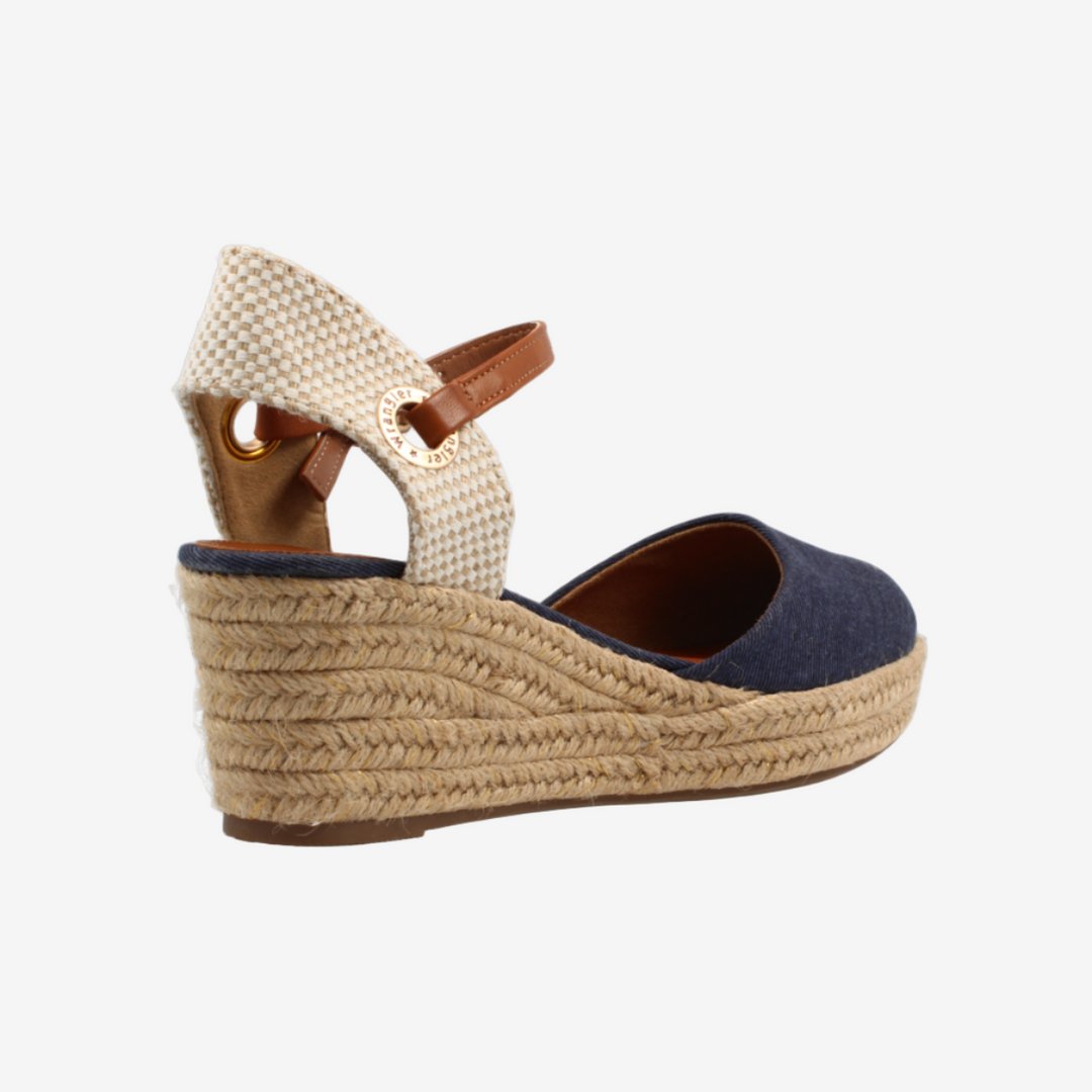 Woven wedge sandal with a white background