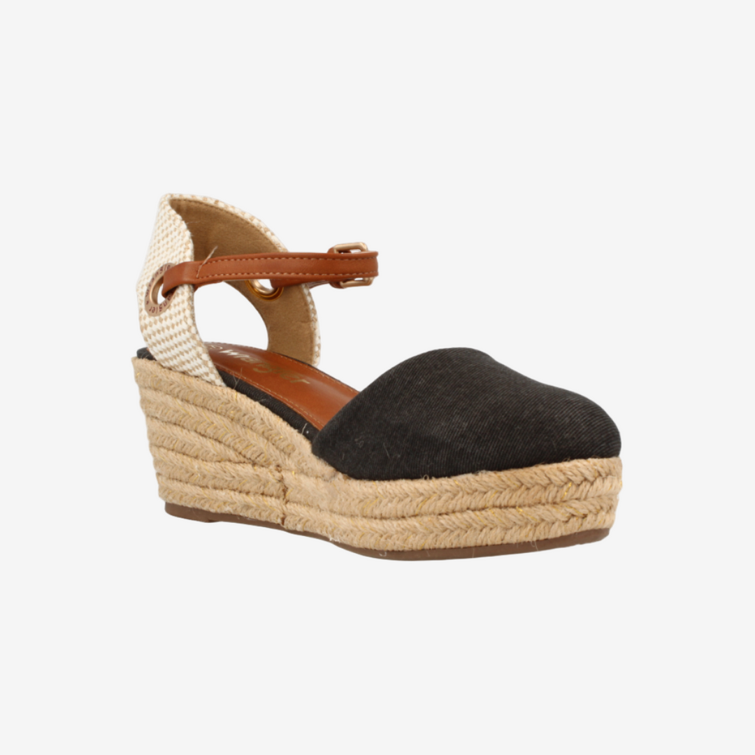 Wedge sandal with black suede upper and beige espadrille sole on a white background