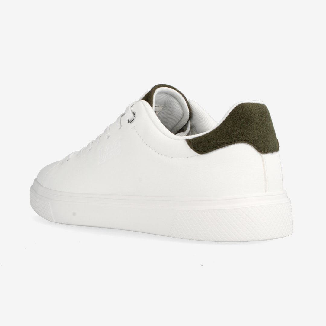 White sneaker with green accents on a white background