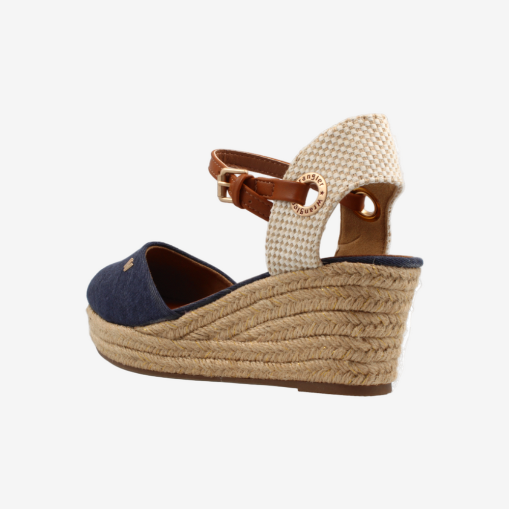 Wedge sandal with textured strap and jute sole on a white background